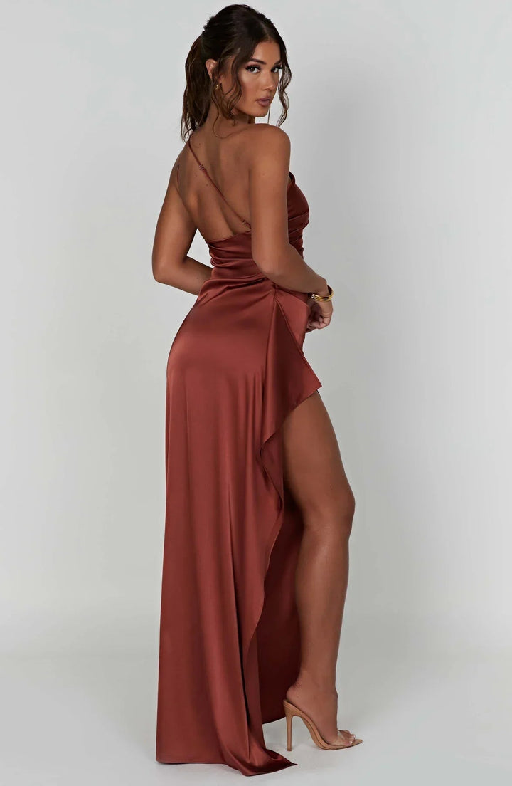 Black one-shoulder dress styled for formal occasion
