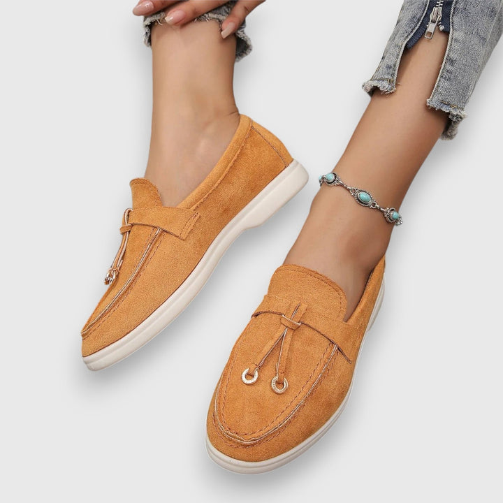 Parker loafers in orange, side profile view highlighting low-profile silhouette