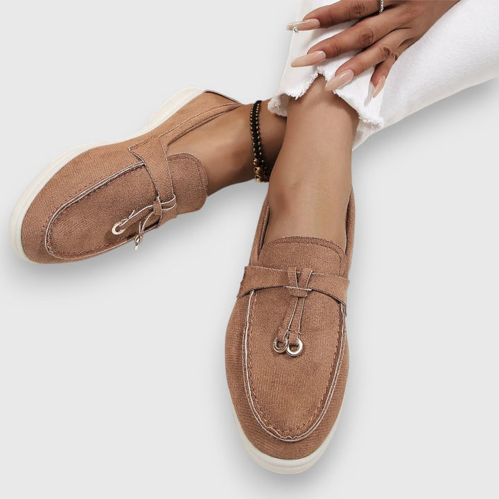Parker women's loafers in brown, three-quarter angle showing tassel accent