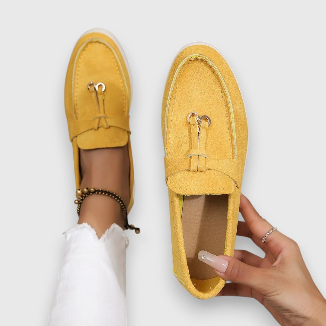 Parker slip-on loafers in yellow on a neutral background, top-down view