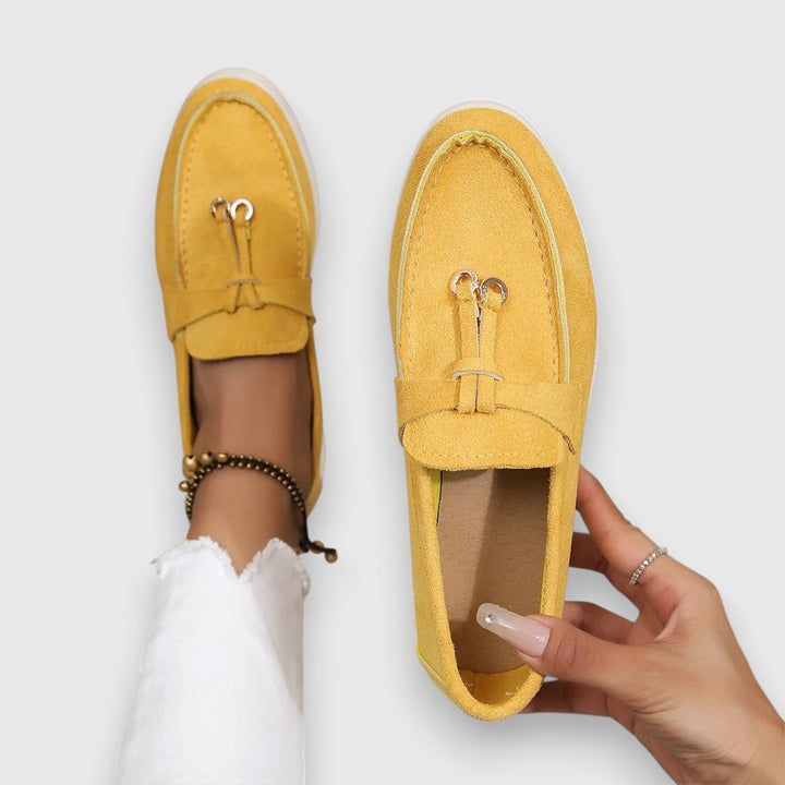 Parker slip-on loafers in yellow on a neutral background, top-down view