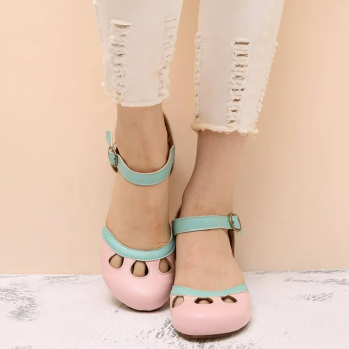 Lifestyle flat lay of Patti low-heeled sandals in green with summer accessories
