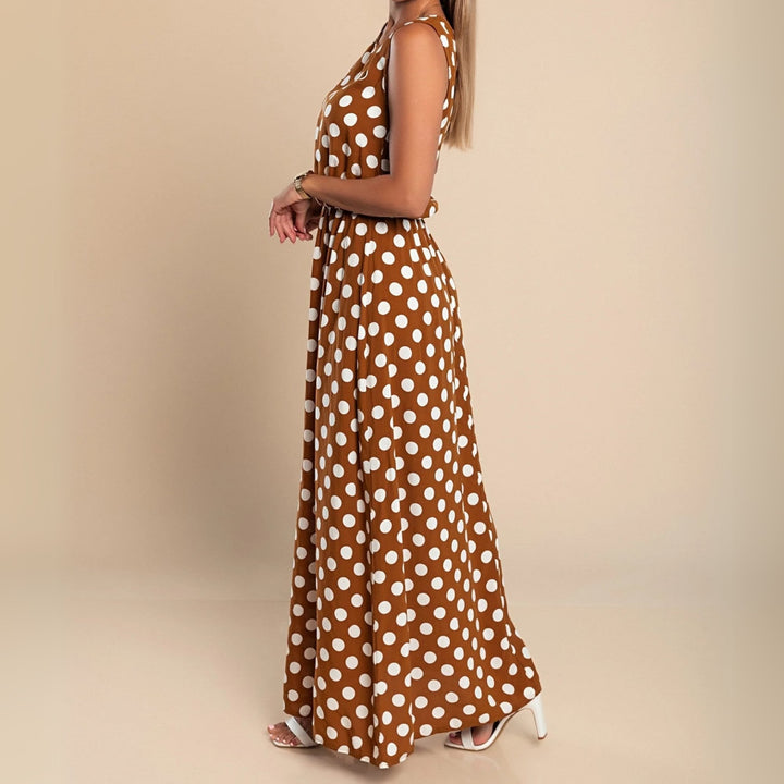 Full-length view of a polka dot maxi dress available in brown, black, and blue