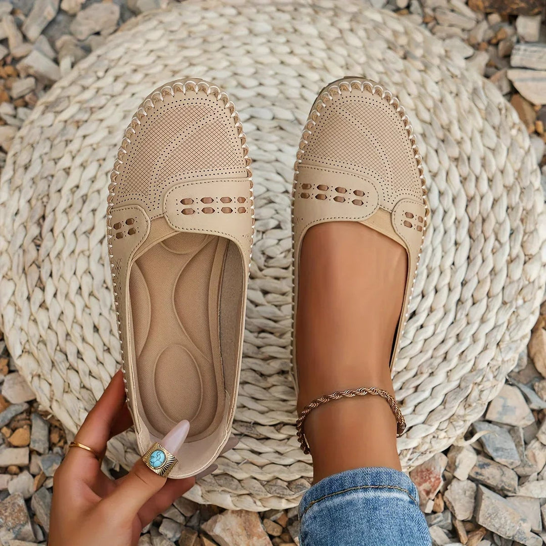 Paulette orthopedic flat in beige showing cushioned insole and ventilated upper, side view
