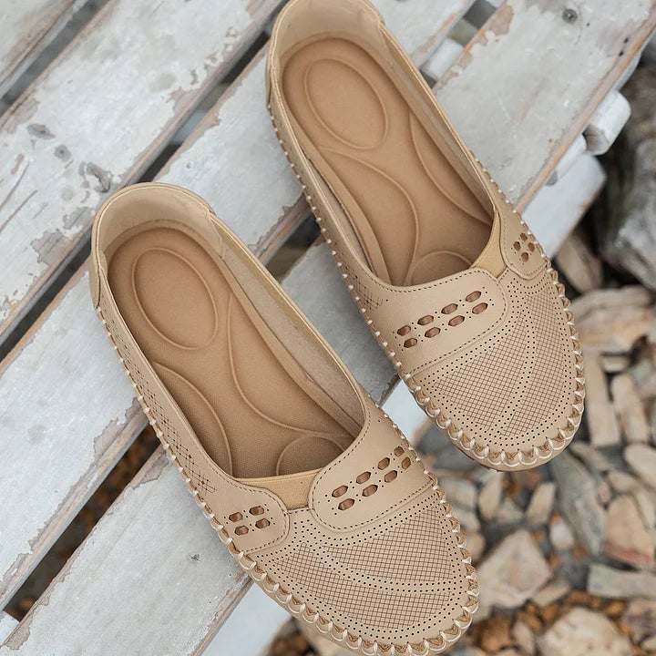Paulette flat in light pink, side profile showing low-profile sole and breathable upper