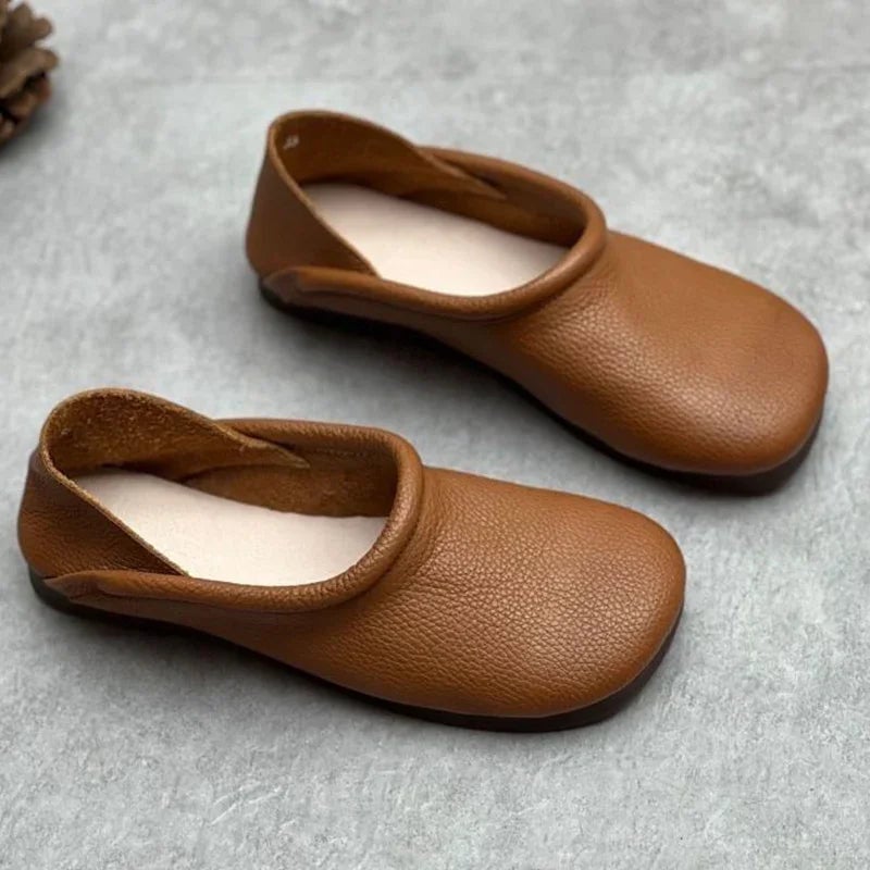 Pearl women's vegan leather flat sandals in brown, front view on white background