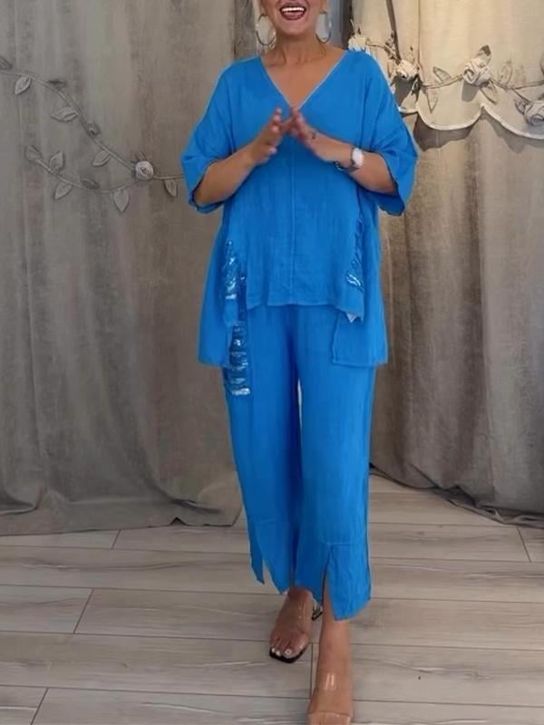 Full-length view of the Pearl linen set in green showing the coordinated top and wide-leg pants together