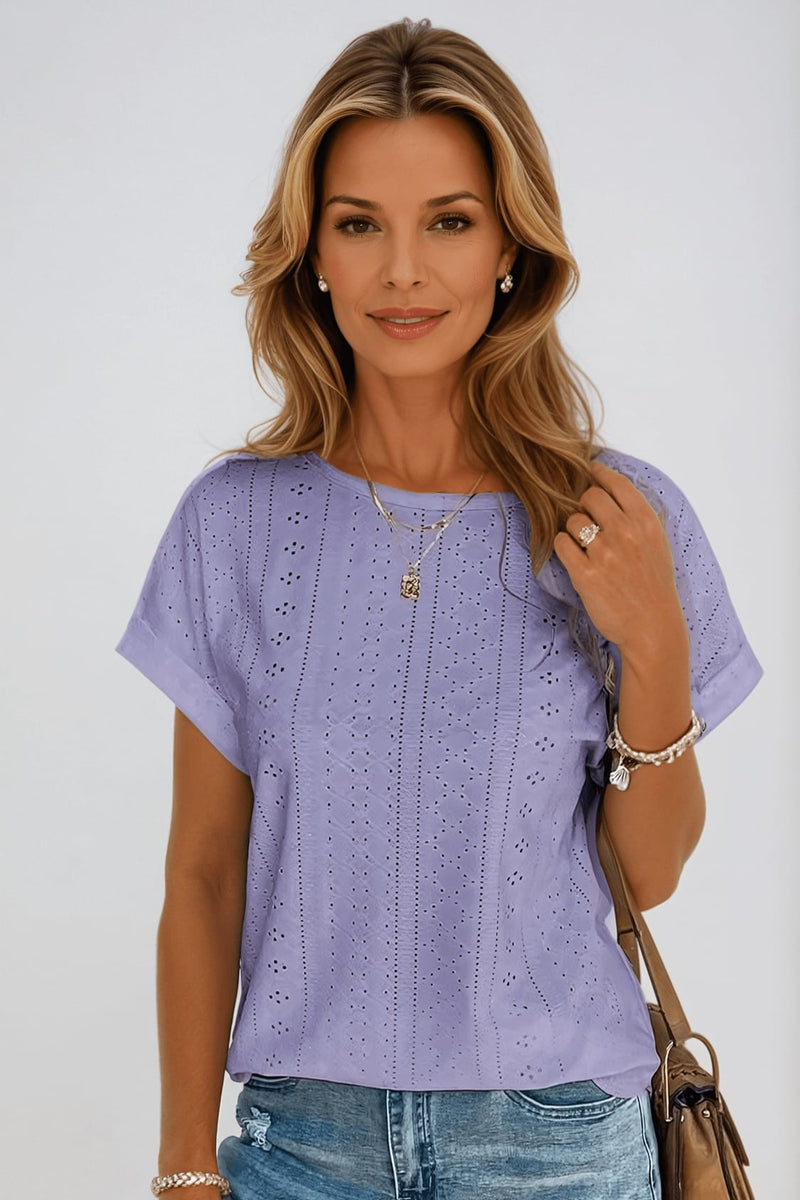 Back view of the women's eyelet crew neck top showing cuffed sleeves and clean silhouette