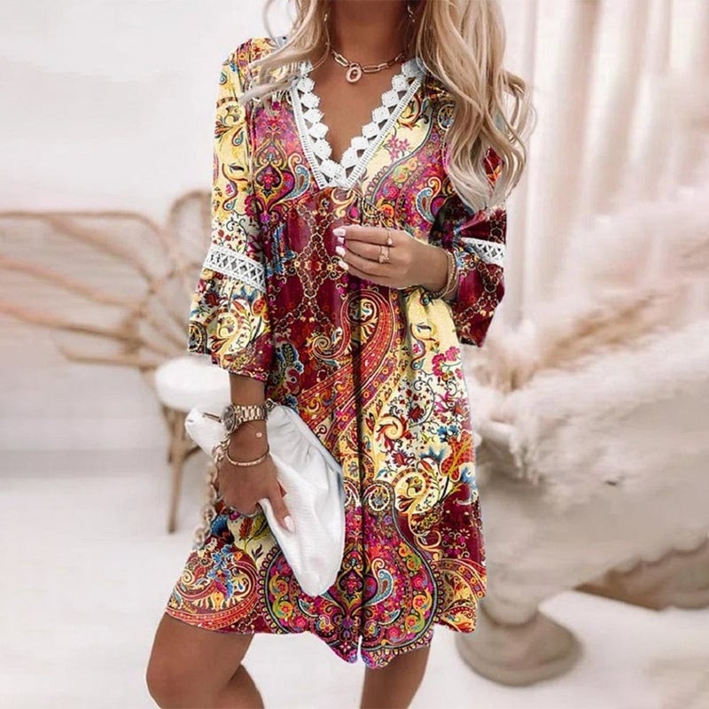 Close-up of the whimsical boho print detail on the Penelope mini dress in red