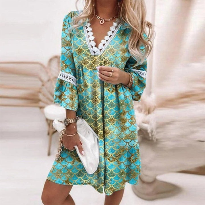 Back view of the Penelope boho printed mini dress in green, highlighting the relaxed fit and mini length