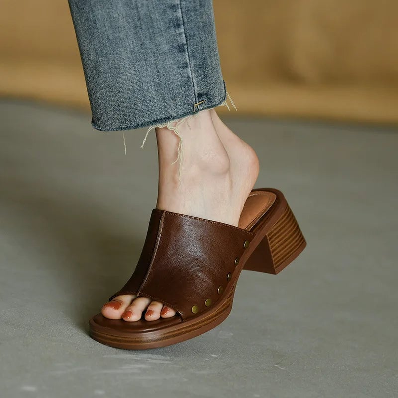 Penelope women's flat sandal in brown, front three-quarter view