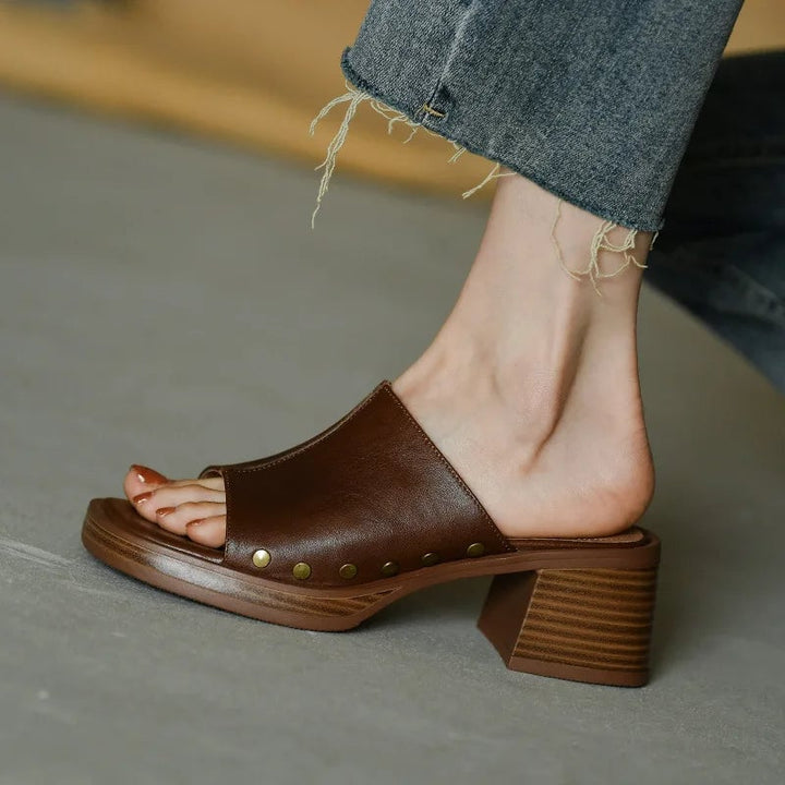 Penelope flat sandals in black and brown displayed side by side