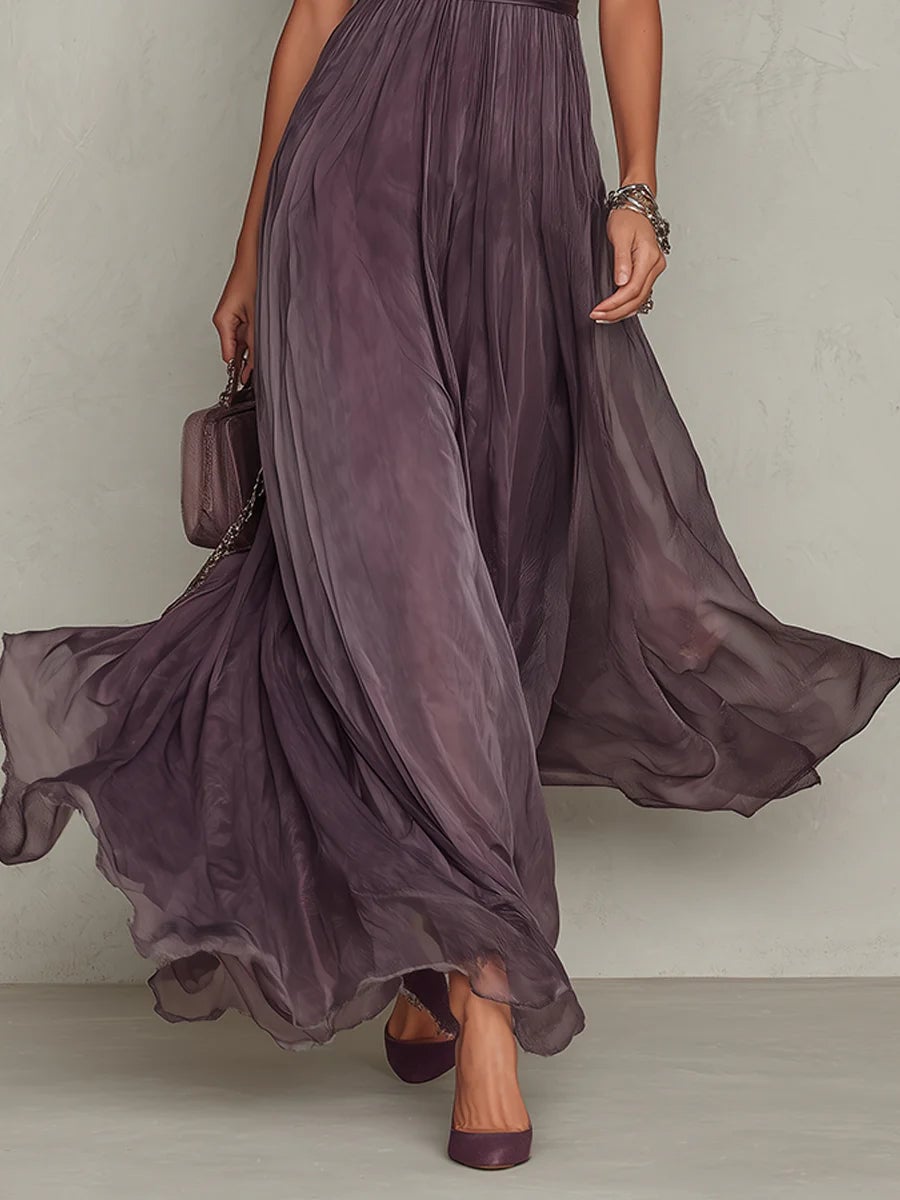Full-length lifestyle shot of a woman in a purple short sleeve keyhole maxi dress outdoors