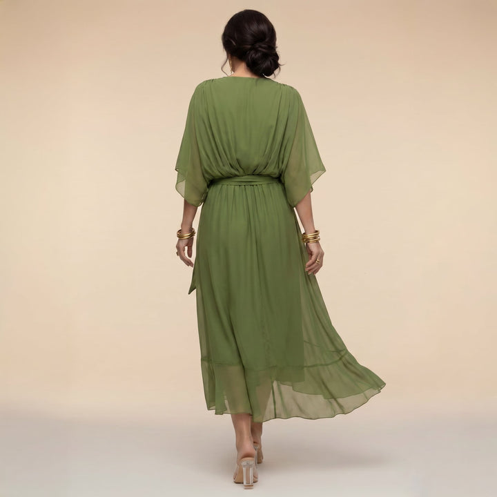 Close-up of adjustable tie waist detail on women's wrap midi dress