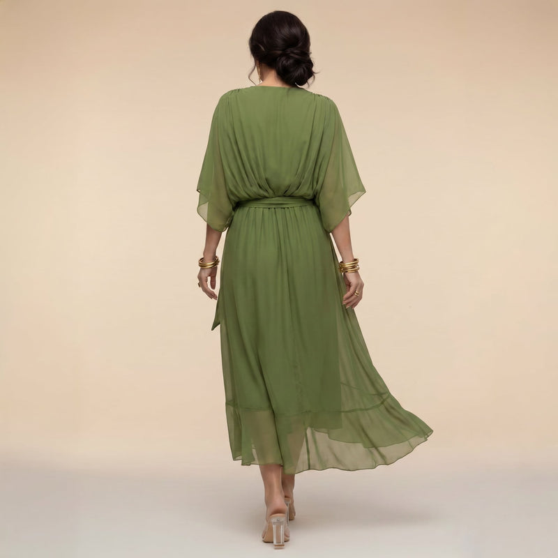 Close-up of adjustable tie waist detail on women's wrap midi dress