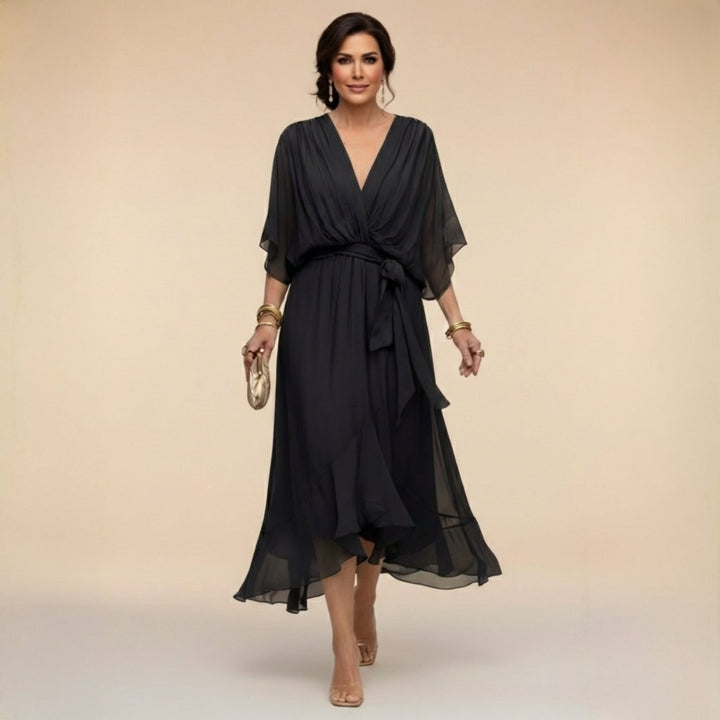 Side view of wrap midi dress showing midi length and draped fabric