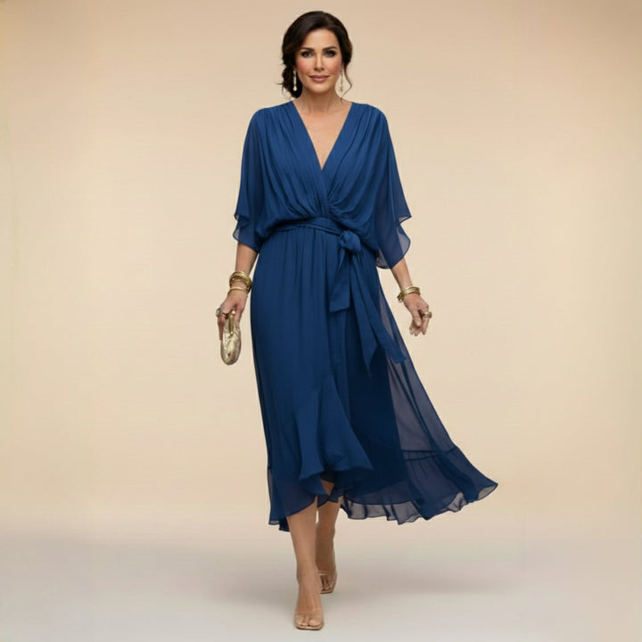 Women's V-neck wrap midi dress in blue styled for a casual daytime look
