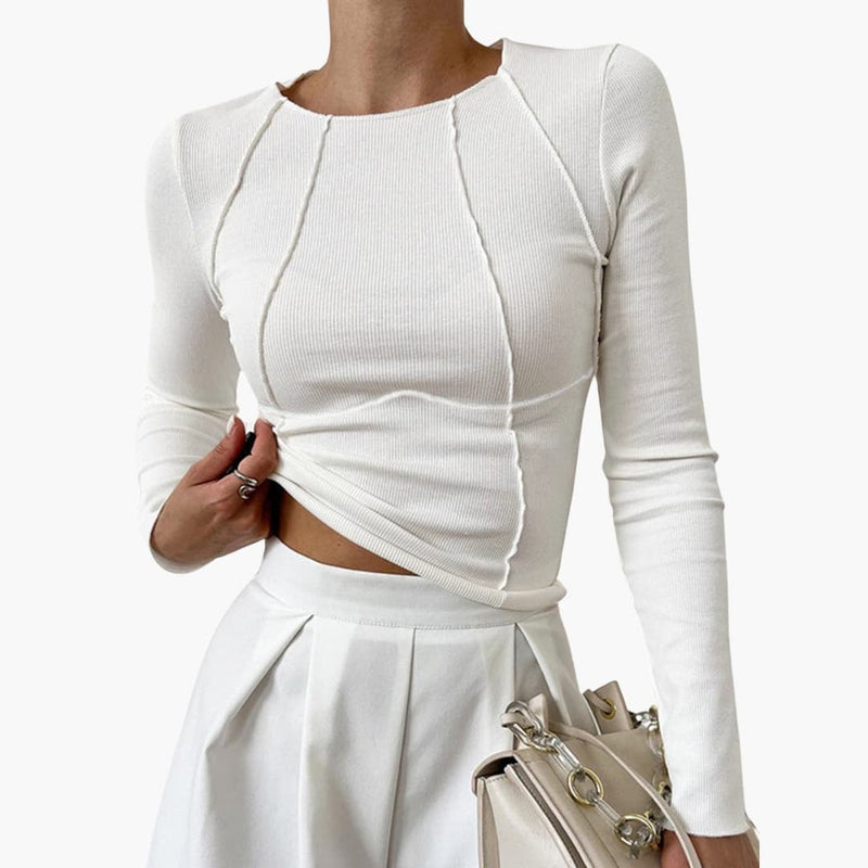 Front view of the sculpted seam long sleeve top in a neutral color, showing vertical seams that elongate the torso