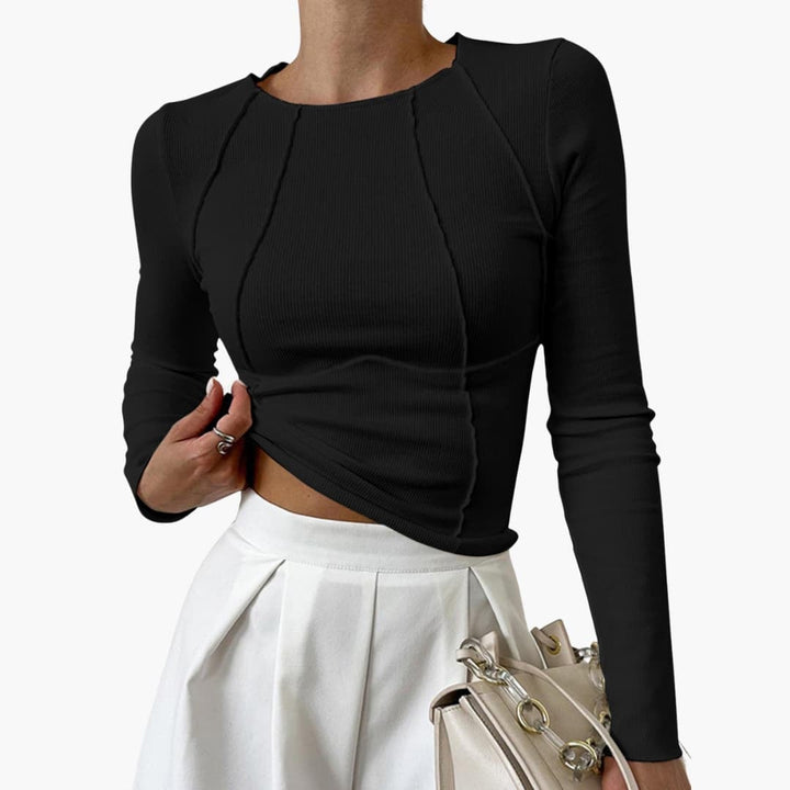 Close-up detail of the sculpted seam long sleeve top highlighting the smoothing stretch fabric and clean finish