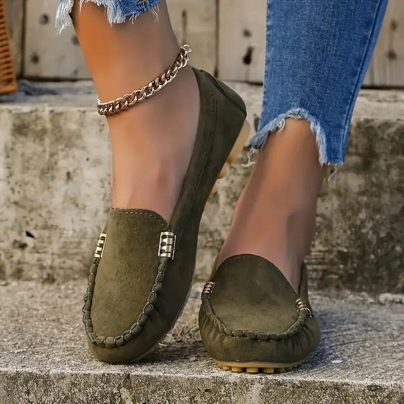 Penny suede-look loafer in green with flexible rubber outsole shown from a low angle, women's casual flat shoe