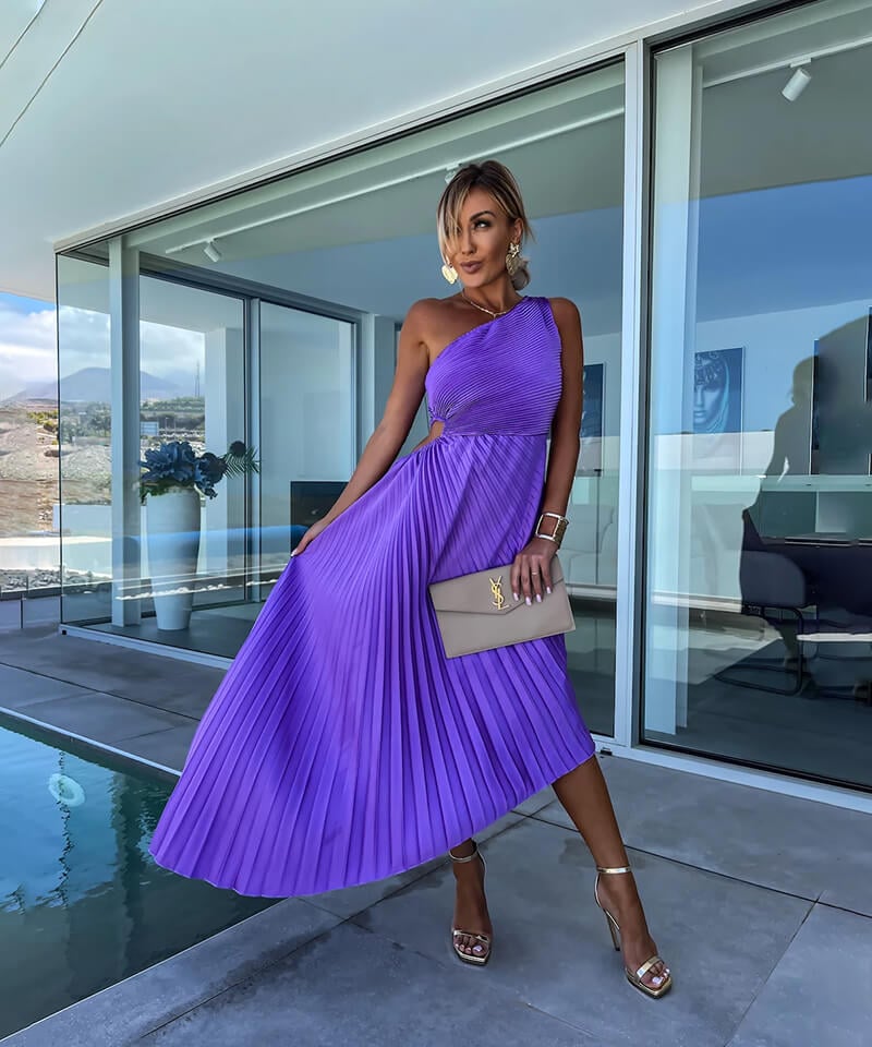 Side view showing the asymmetric neckline and midi length of the purple Peony dress