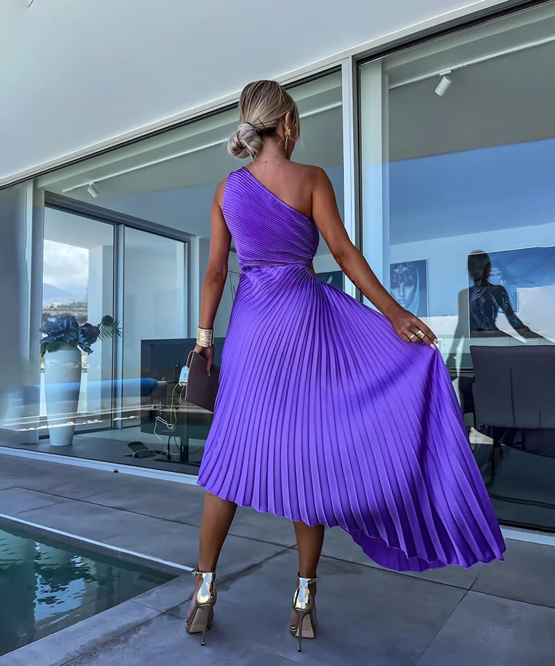 Full-length front view of model wearing the purple Peony asymmetric midi dress
