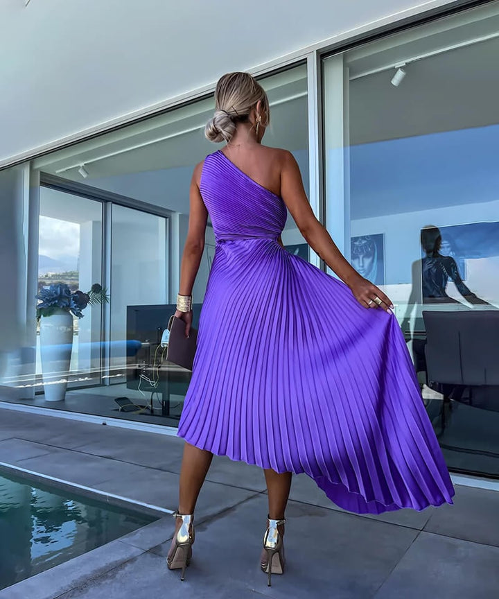 Full-length front view of model wearing the purple Peony asymmetric midi dress