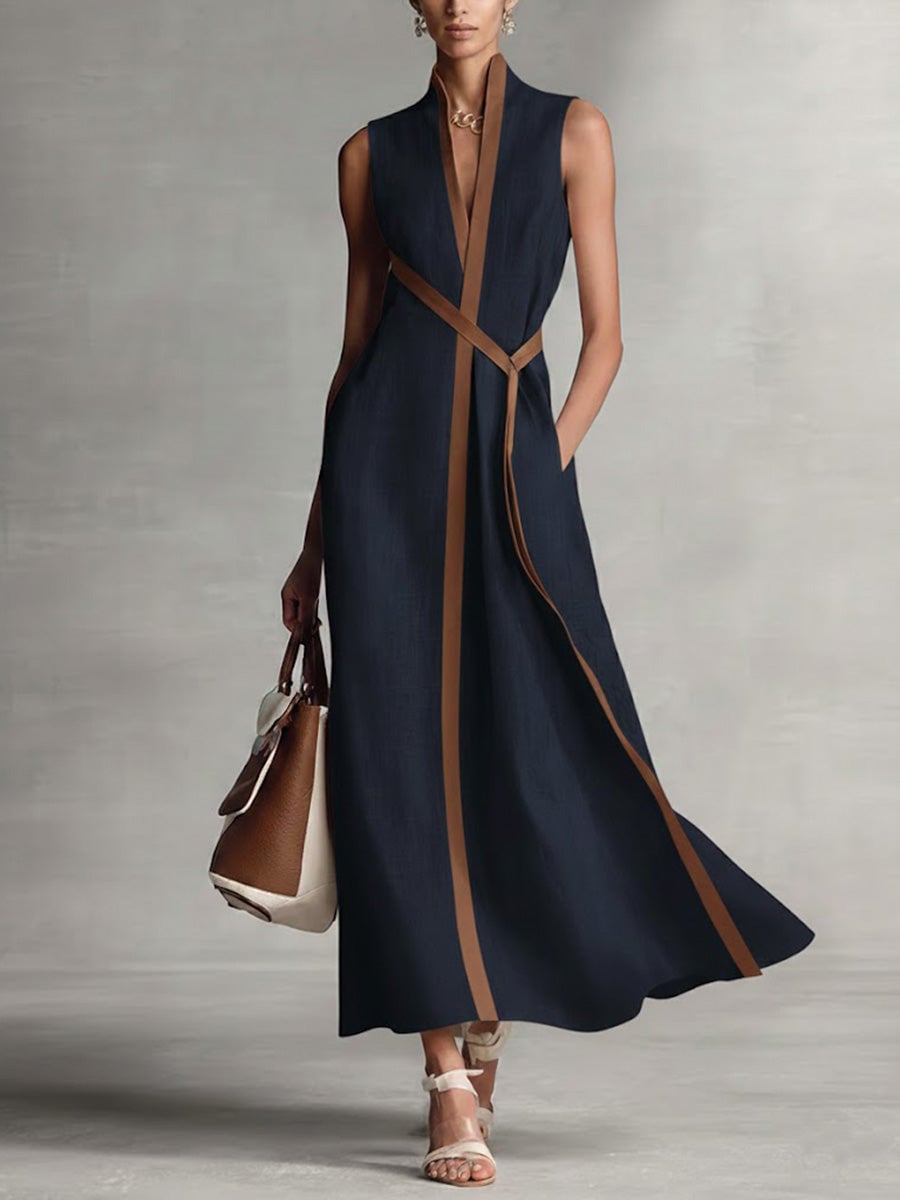 Woman wearing a white sleeveless V-neck wrap maxi dress with a flowing silhouette, front view