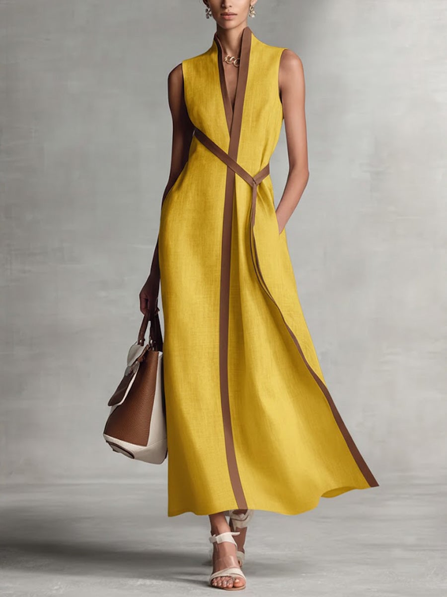 Side view of a woman in a burgundy V-neck wrap maxi dress highlighting the adjustable wrap fit