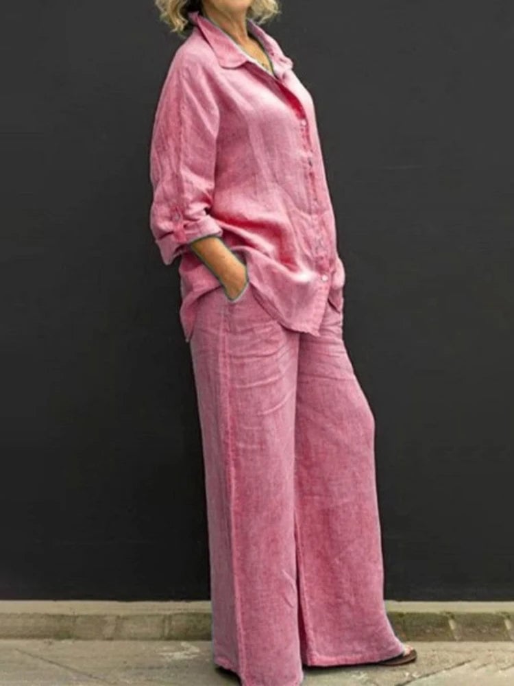 Front view of the Petra wide-leg linen pants with side pockets styled with the matching longline shirt in pink