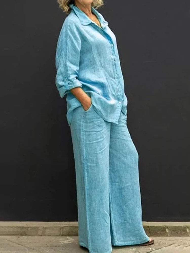 Close-up of the Petra linen shirt collar and full button front detail in blue