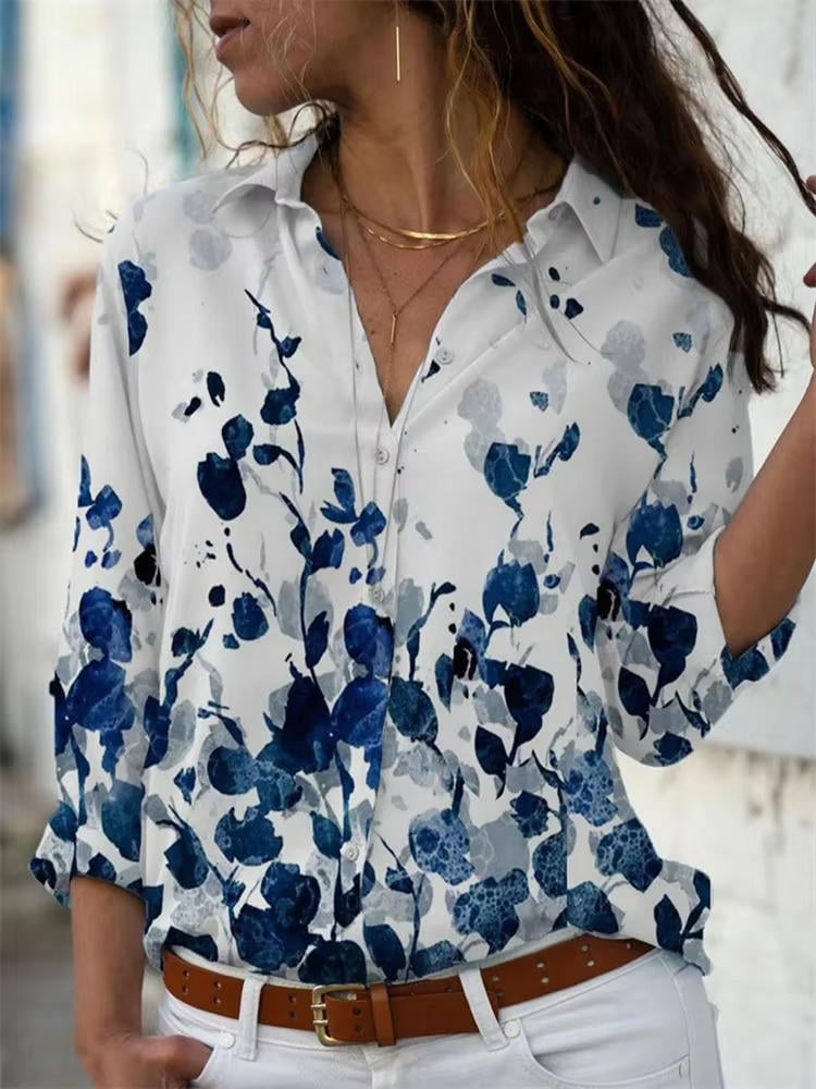Close-up of the Petra shirt's bold triangle geometric print and classic collar detail