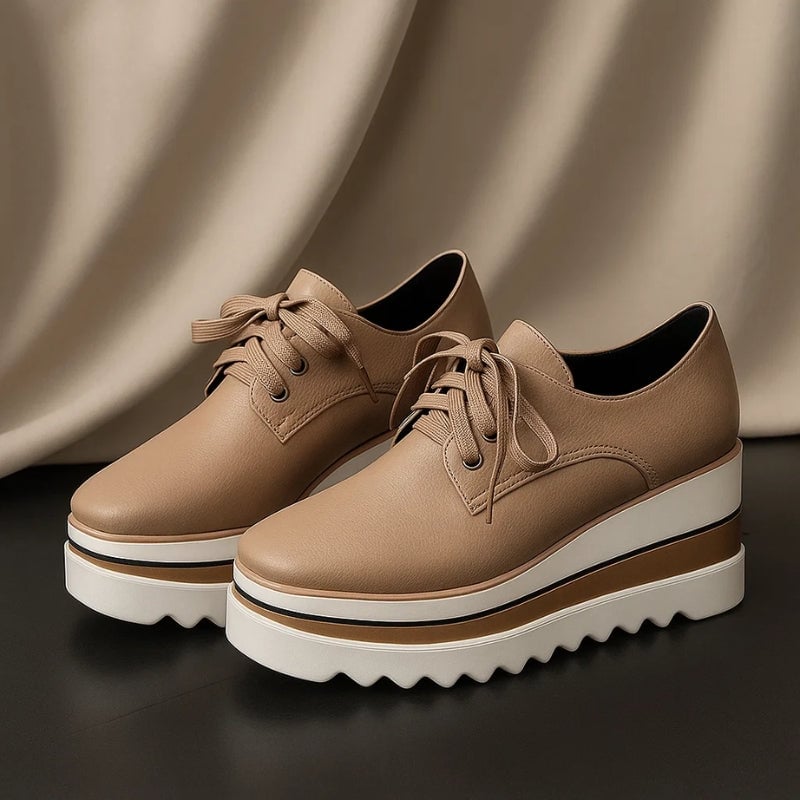 Petra Oxford wedge sneaker outsole detail showing chunky wave-pattern rubber tread