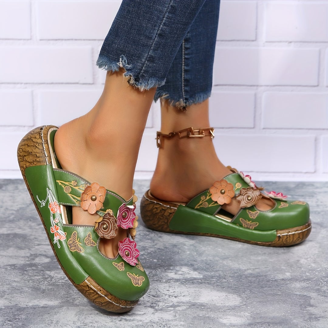 Model wearing the Phoebe wedge sandals in green paired with a floral midi dress, full-length lifestyle shot