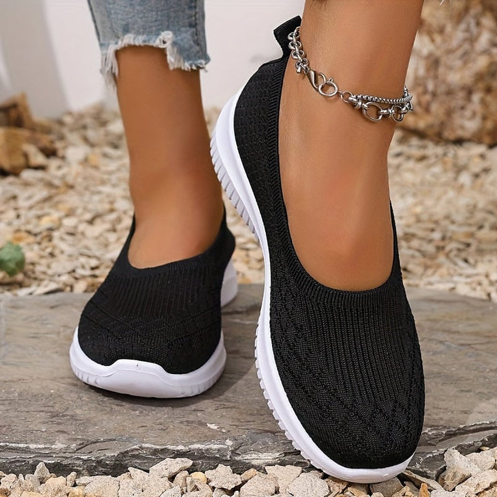 Women's slip-on shoes displayed in multiple colors including apricot, pink, black, purple, and red