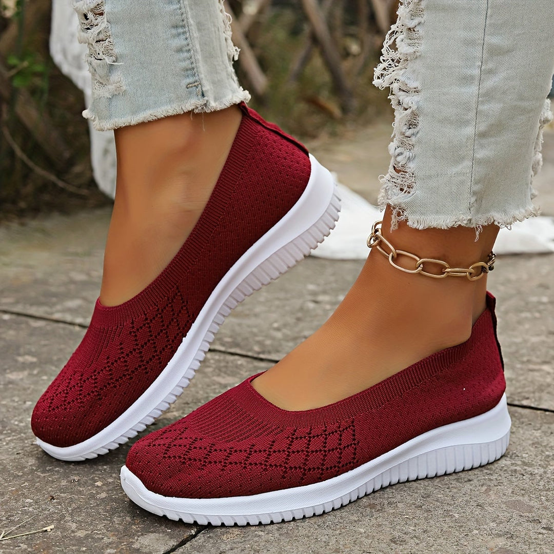 Woman wearing breathable slip-on shoes while walking, showcasing all-day comfort and ease