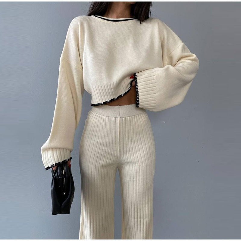 Three-quarter view of the Piper knitted set in blue showing cropped sweater fit