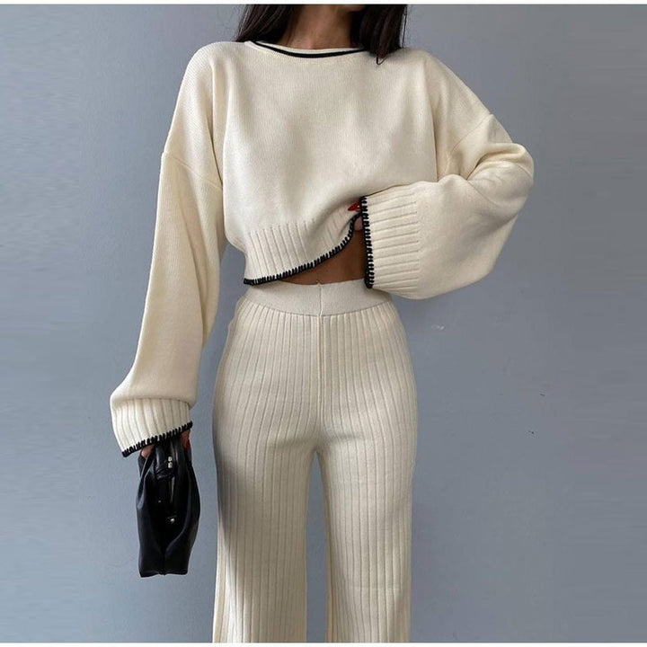 Three-quarter view of the Piper knitted set in blue showing cropped sweater fit