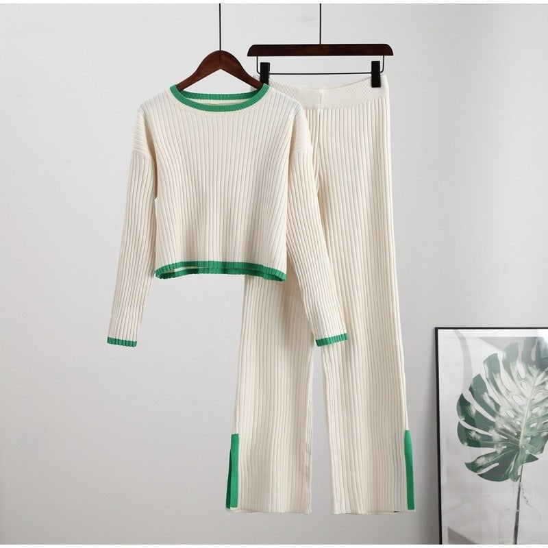 Lifestyle shot of model in green knitted two-piece set carrying a neutral tote bag