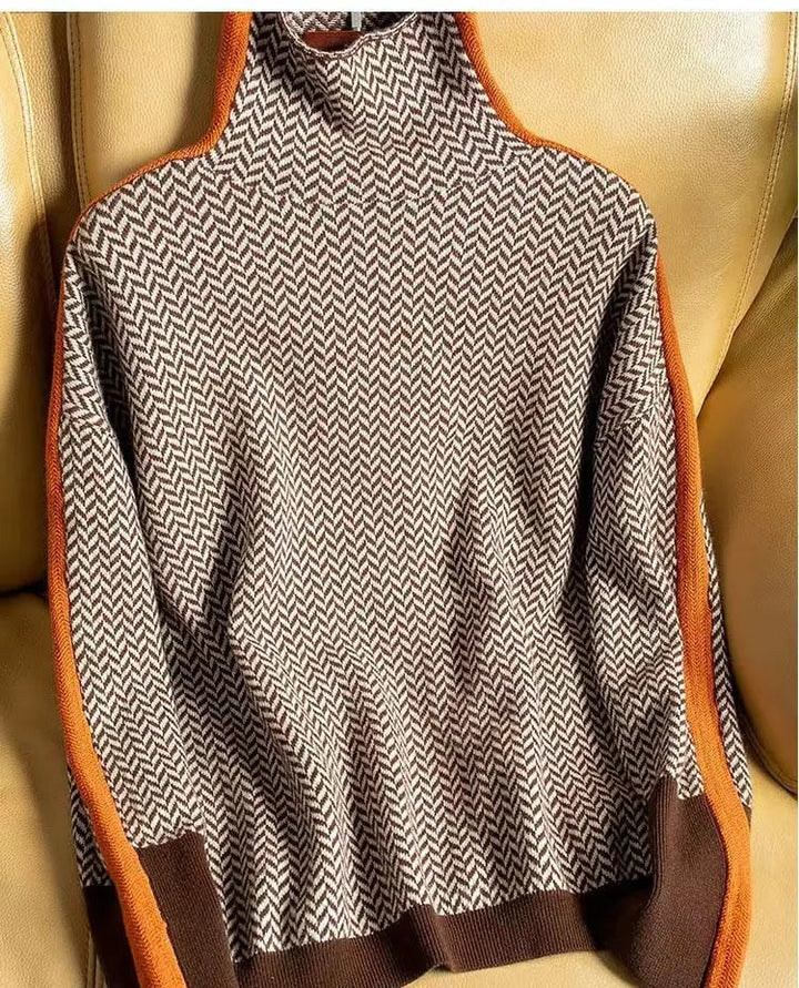 Front view of the Florimay herringbone luxe turtleneck in orange, showing the textured pattern and fitted silhouette