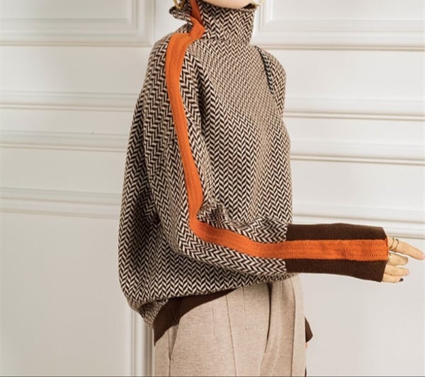 Flat lay of the Florimay herringbone turtleneck in green showing the one-size silhouette