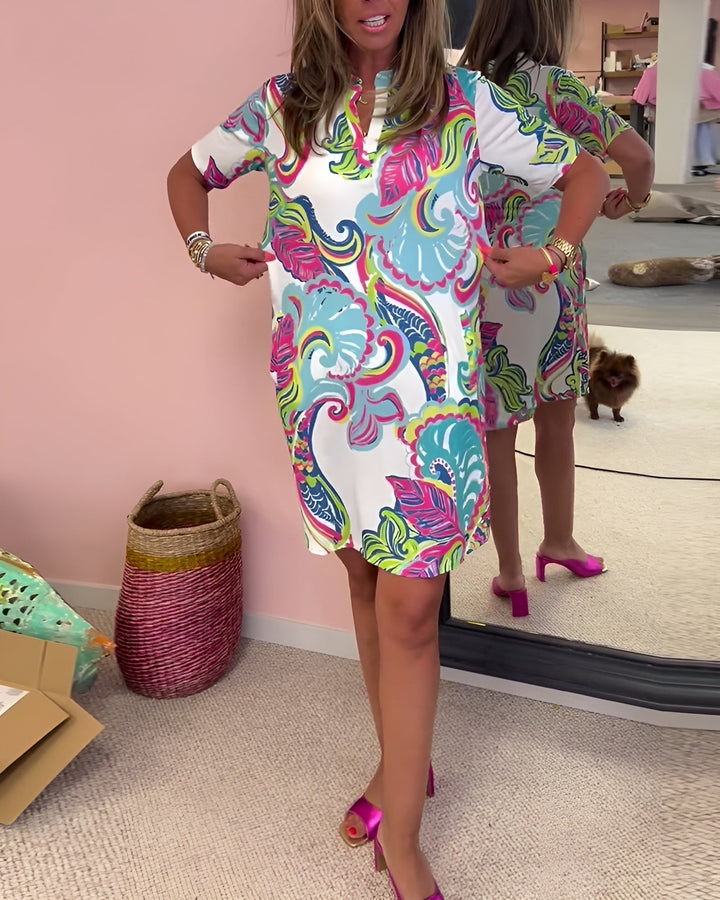 Full-length view of the Piper printed V-neck dress styled with sandals for a summer day look
