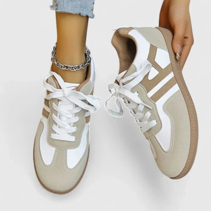 Piper retro colorblock low top sneaker in beige and white with tonal side stripe and gum rubber sole, front three-quarter view