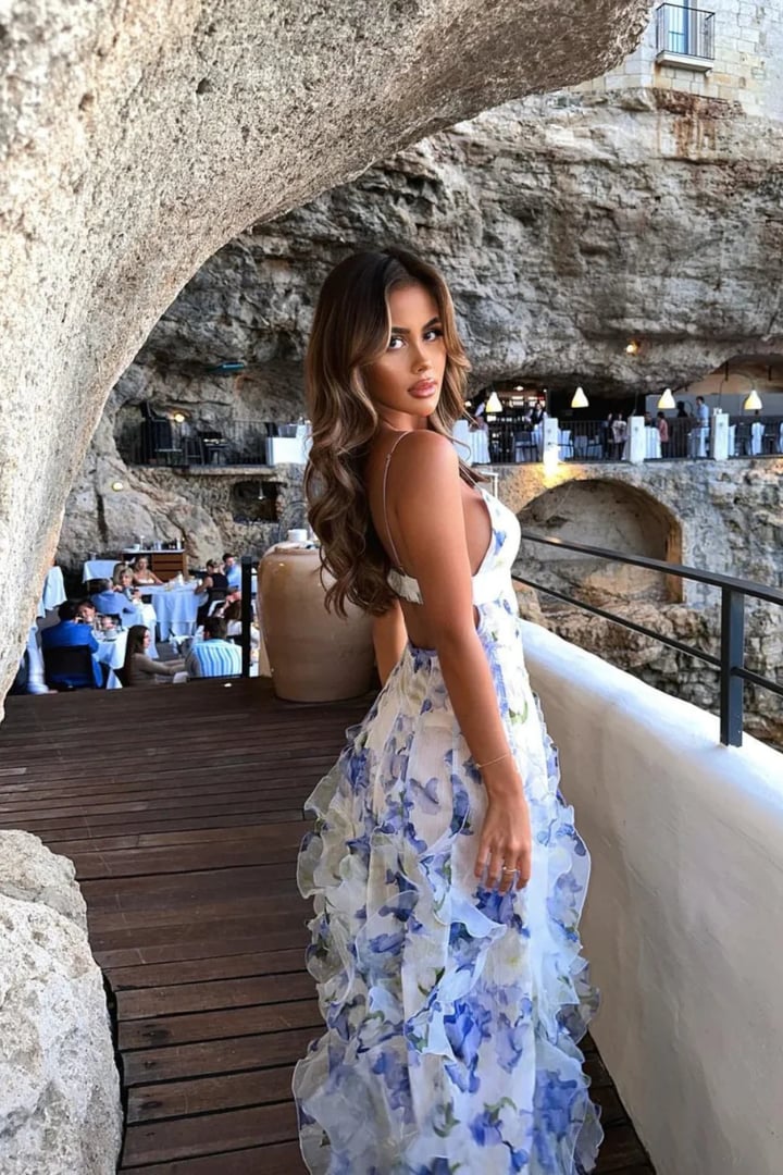 Close-up of the floral print and ruffle trim on the Pippa maxi dress in blue and white