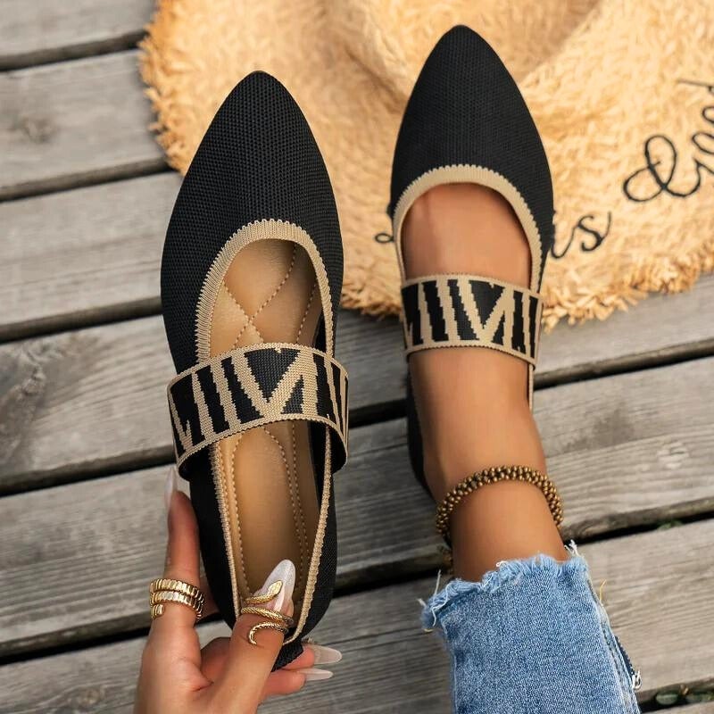 Pippa ballet flats in beige worn with a flowy midi skirt, lifestyle shot