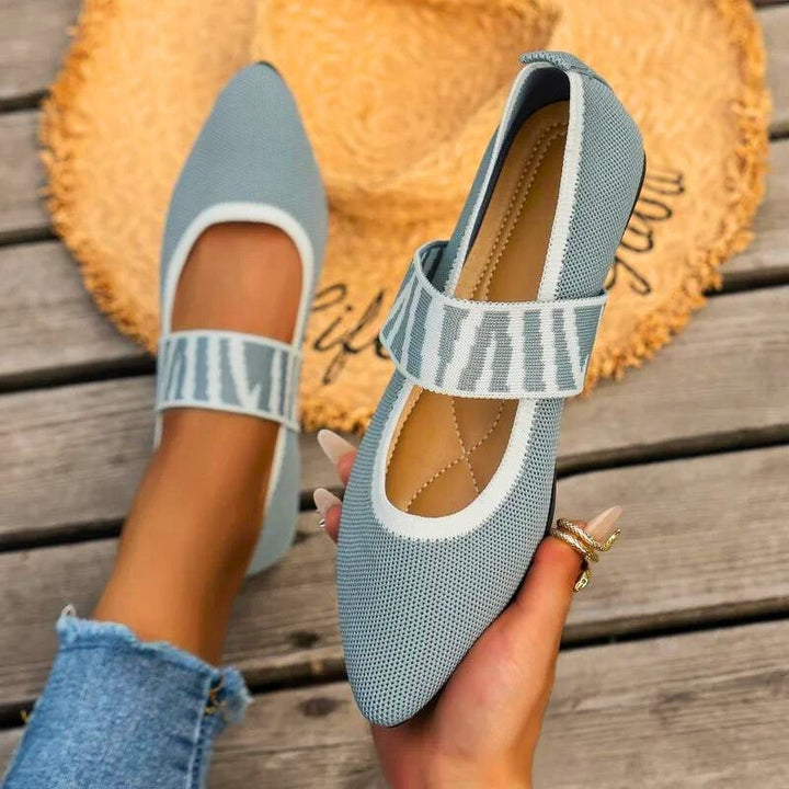 Pippa pointed toe knit flats in green, angled front view showing strap detail