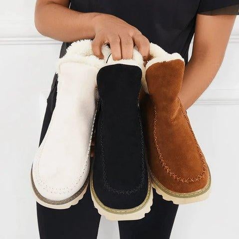 Pair of PolarBelle premium winter boots in beige displayed on a clean white surface