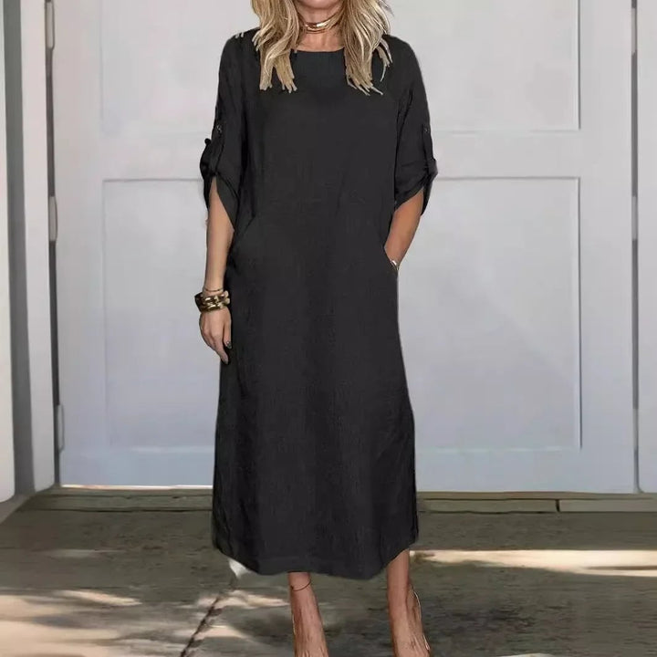 Front view of the Poppy dress showing the flowing A-line silhouette and soft drape