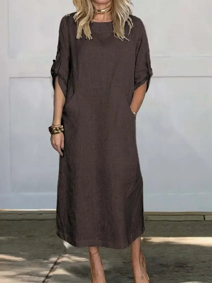 Woman in the Poppy dress styled with sandals for a casual summer look