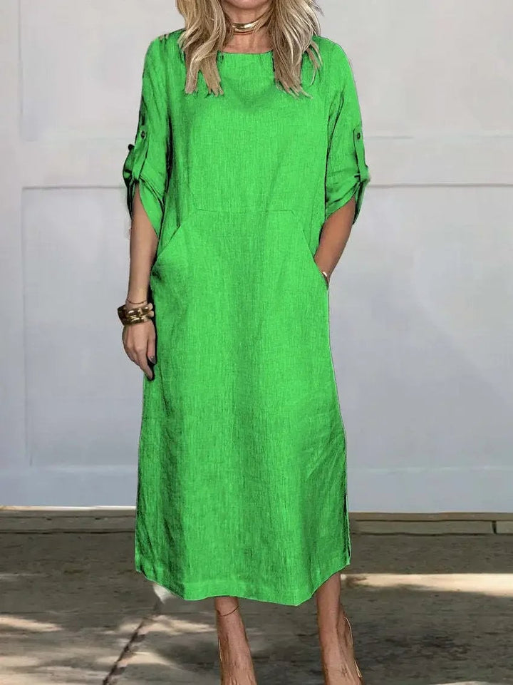 Color options of the Poppy dress displayed side by side including white, black, and blue